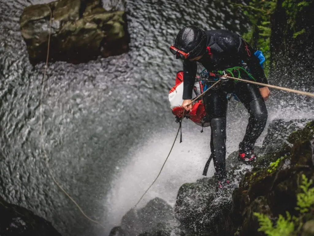 rappelling down canyon