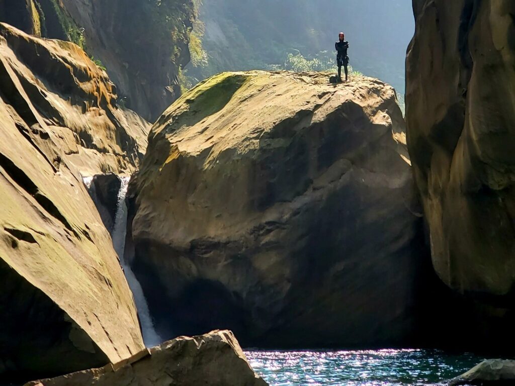 Jumping from a big boulder Canonying